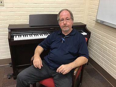 Experienced music instructor at Pensacola State College with keyboard, emphasizing success in higher.