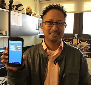 Mobile application developer demonstrating custom software solutions for Apple platforms at Pensacol.