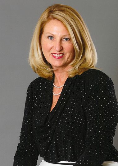 Prominent education leader Pam Stewart at Pensacola State College graduation event.