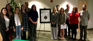 Students inducted into Sigma Beta Delta honor society at Pensacola State College.