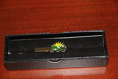 Elegant custom-made Pensacola State tie pin featuring Land Down Under design for alumni and students.