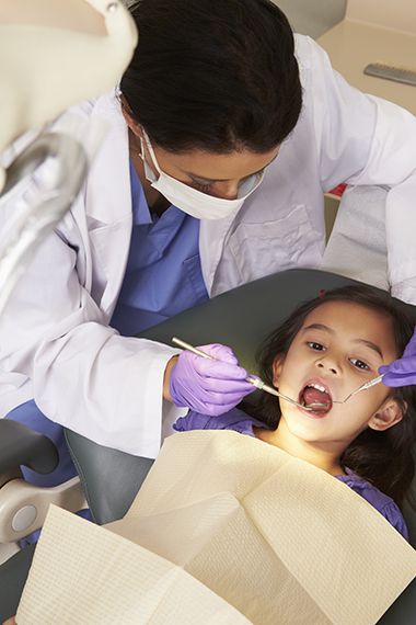 Dental care for children during Give Kids A Smile Day at Pensacola State College.