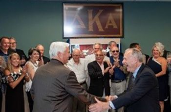 Faculty and students gather to celebrate the Delta Kappa Alpha Memorial Cabinet dedication at Chadbo.