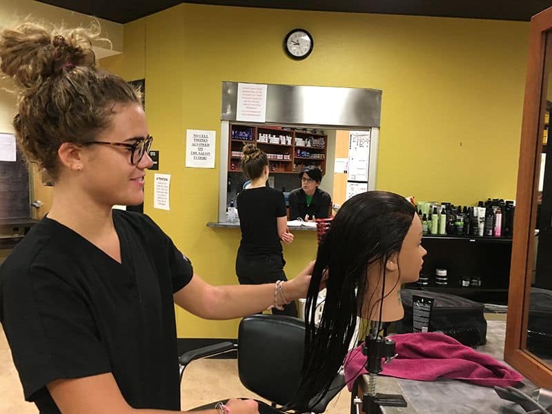 Pensacola State College ‘Suit-Up’ event at JC Penney High school students preparing for college with professional attire at Pensacola State's Suit-Up eve.