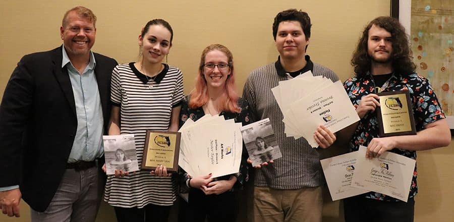 Highly accessible image of Pensacola State students celebrating their awards at the FCS Publication.