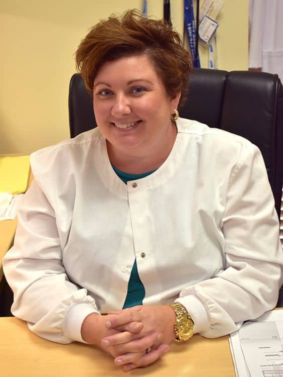 Highly skilled veterinary technician graduate from Pensacola State College, demonstrating excellence.