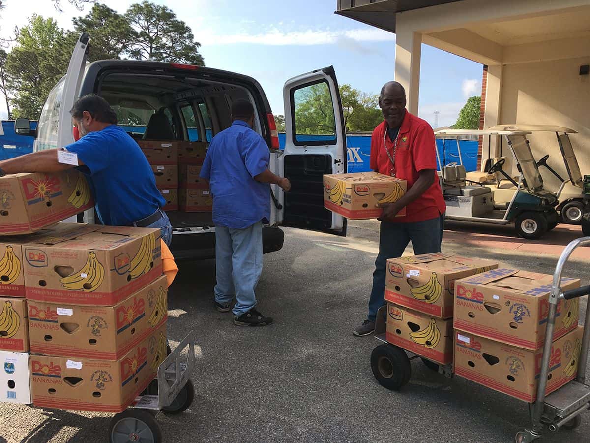 Food donation to PSC students by Manna Food Pantries Food donation event at Pensacola State College for vulnerable students.