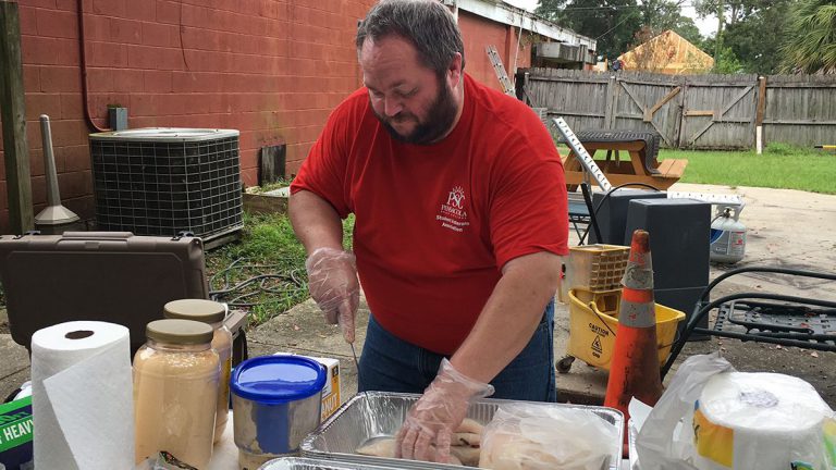 Student Veterans Association member participating in community service event honoring 9-11 tragedy.