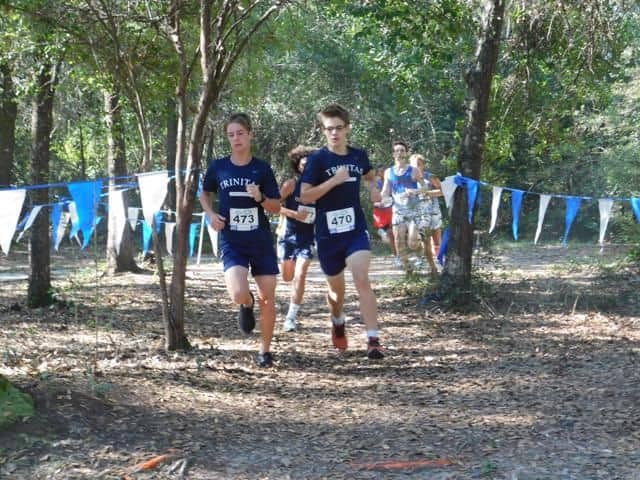 High school students competing in cross country race at Pensacola State College Milton campus outdoo.