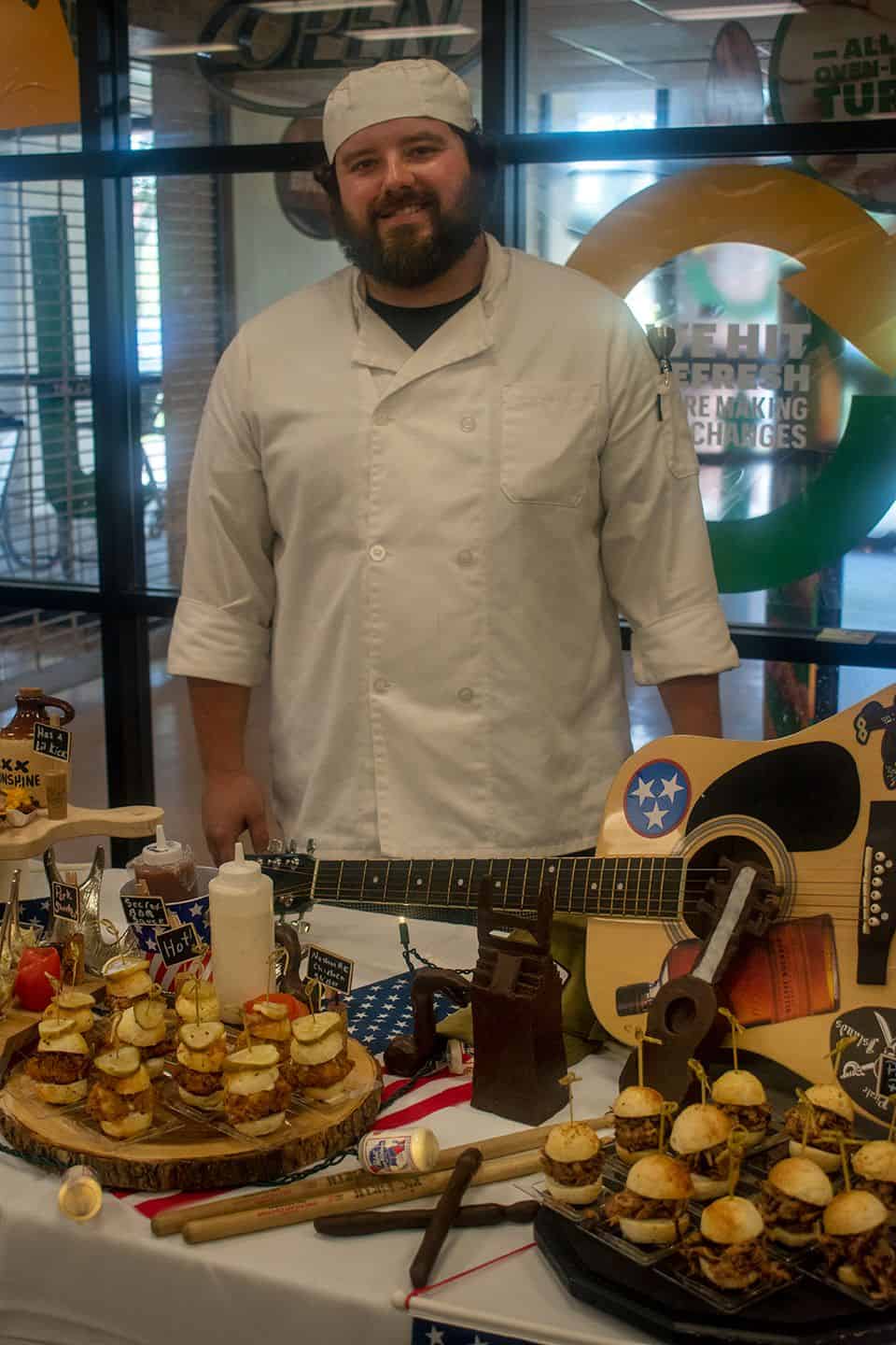 Garde Manger Culinary Event at Pensacola State College Garde Manger culinary student showcasing skills during college celebration event.