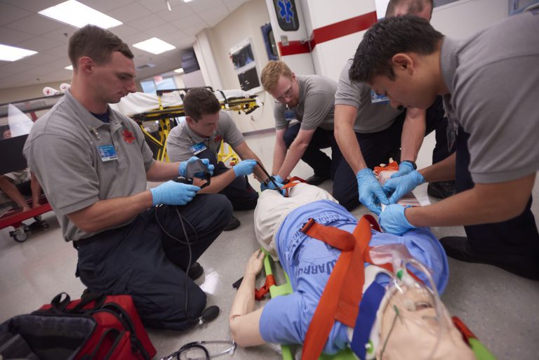EMS students performing patient care training for paramedic certification at Pensacola State College.
