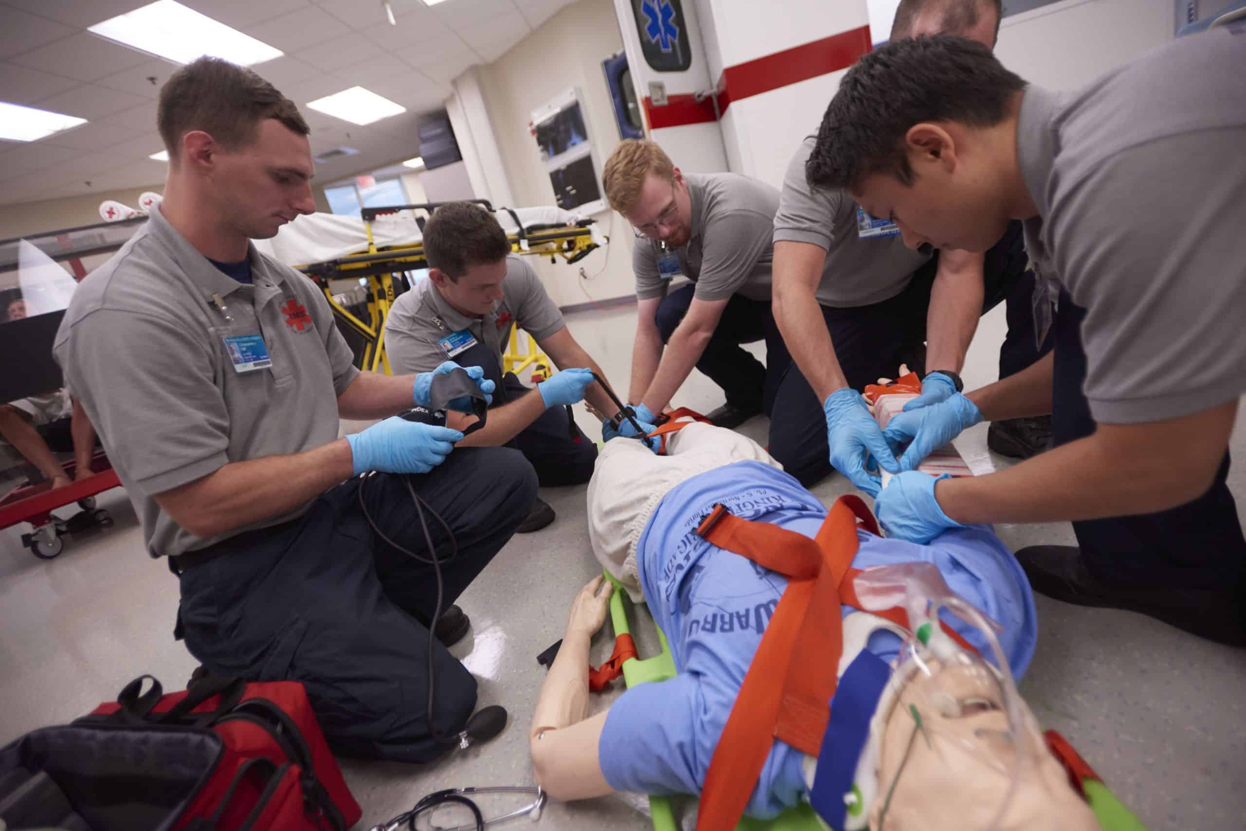 EMS students performing patient care training for paramedic certification at Pensacola State College.