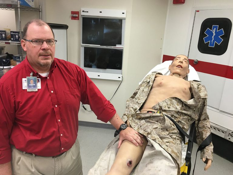 Realistic EMS training manikin at Pensacola State College designed to simulate injury and pain for s.