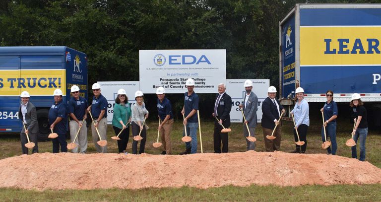 Pensacola State College groundbreaking for new truck driver training facility with students and offi.
