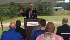 Modern truck driver training facility groundbreaking event at Pensacola State College for workforce.