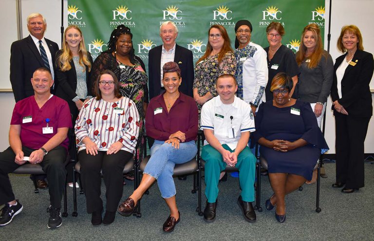 Diverse group of students and staff celebrating scholarship success and educational opportunities at.