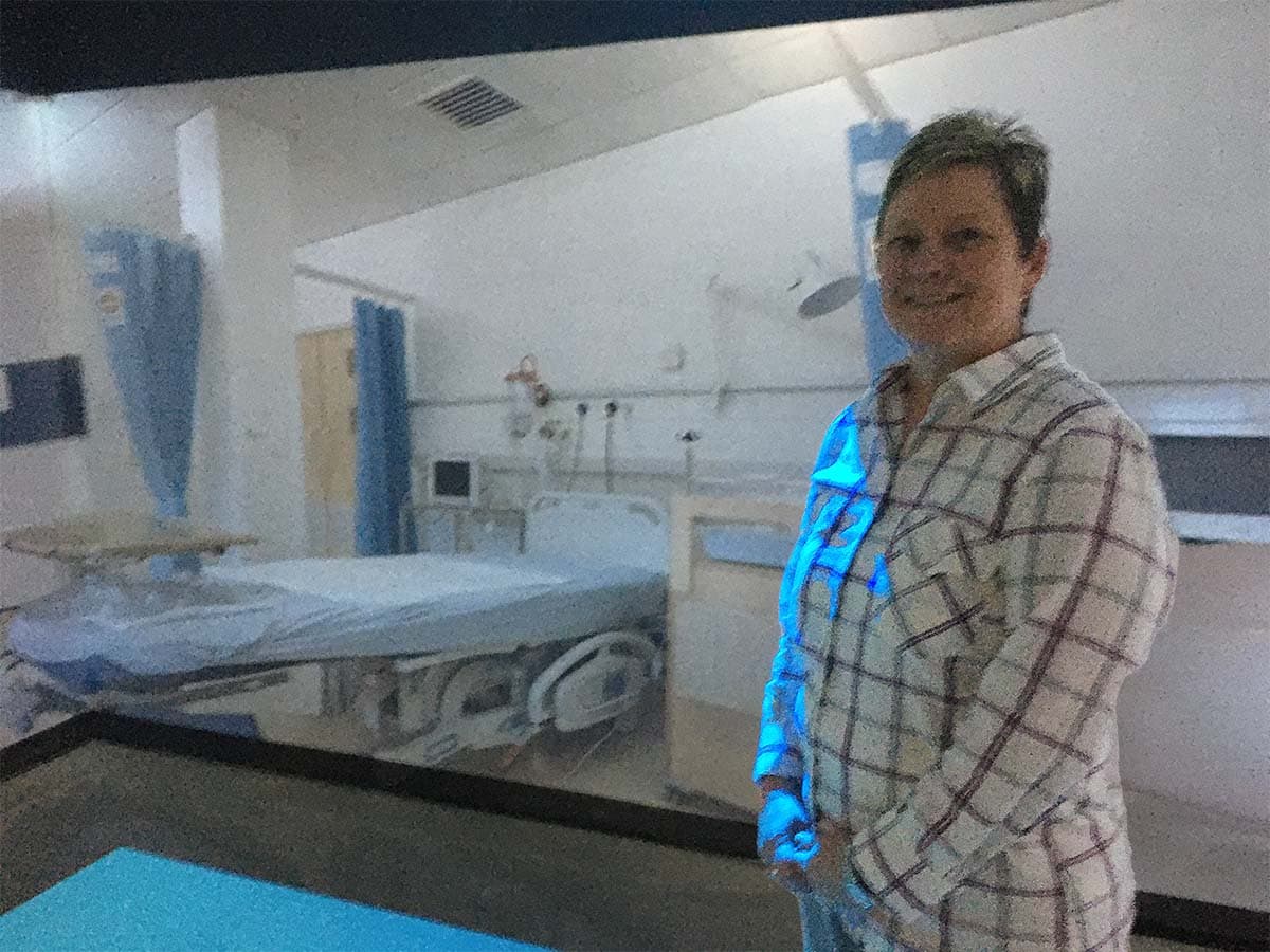 Student engaging with virtual healthcare simulation in PSC Health Sciences Department.