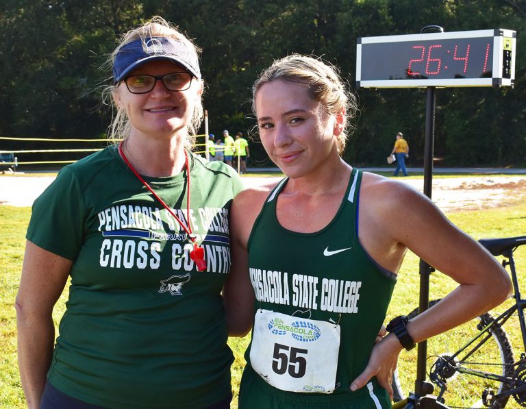 Marine Sgt. Maria Tibbetts, PSC student-athlete, at cross country race, heading to national champion.