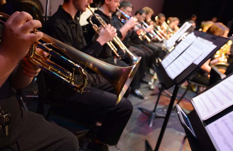 Ensemble of college musicians performing in a concert band at Pensacola State College.