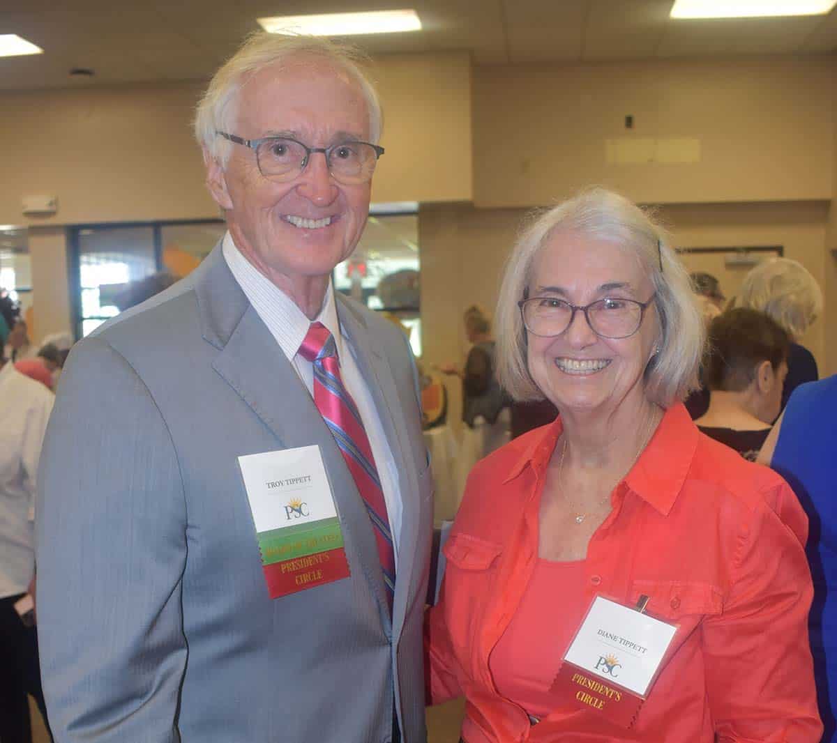 Dr. Troy Tippett and a female colleague at Pensacola State College during a formal event.