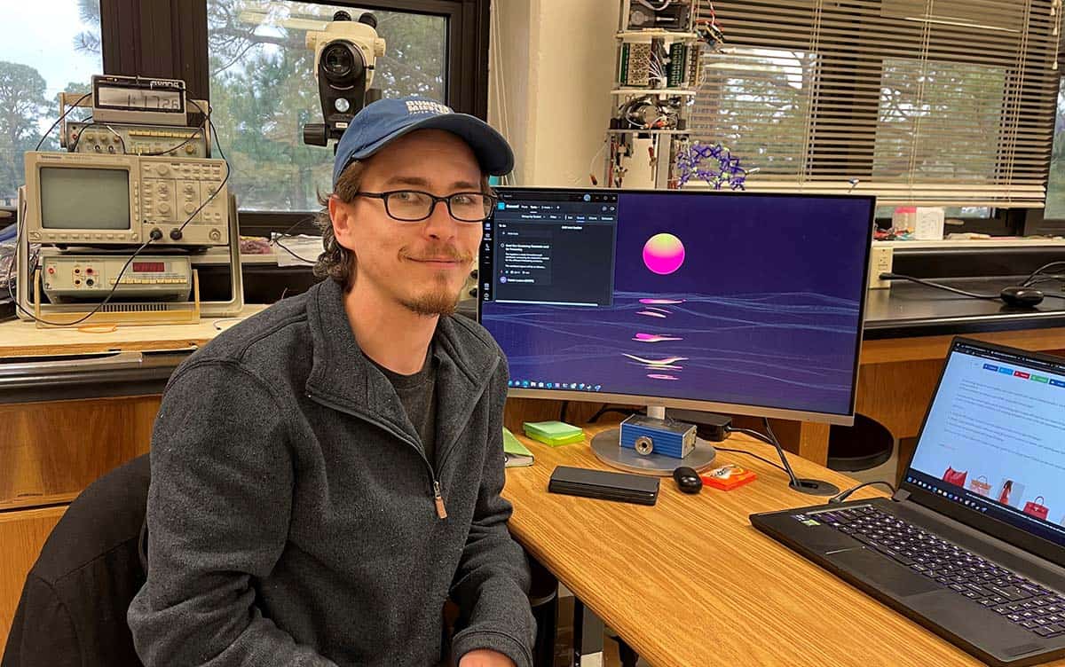 Engineering student working on particle systems for open house at Pensacola State College.