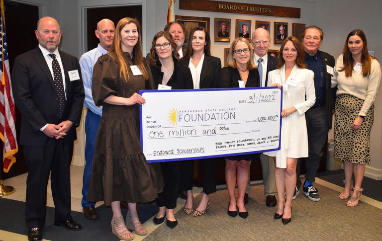 High-resolution image of supporters presenting a $1M scholarship donation for the new STEM building.