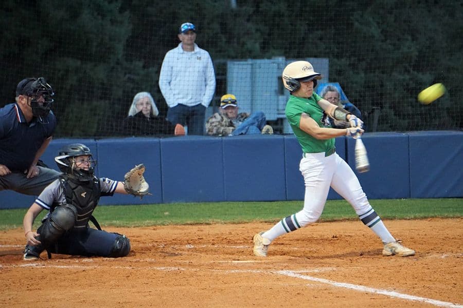 High school softball player batting during game at Pensacola State College.