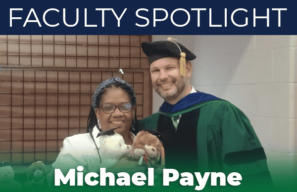 Business Strategy Professor Michael Payne with student at Pensacola State College.