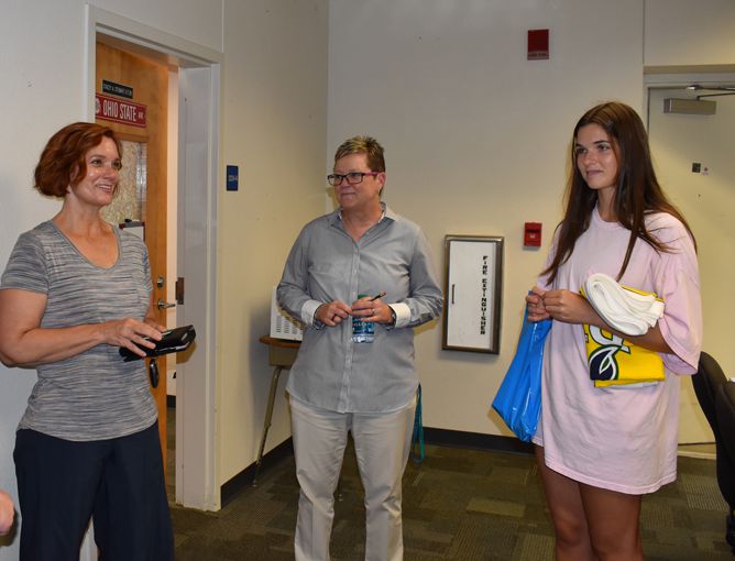 Prospective students engaging with staff during Pirate Open House at Pensacola State College.