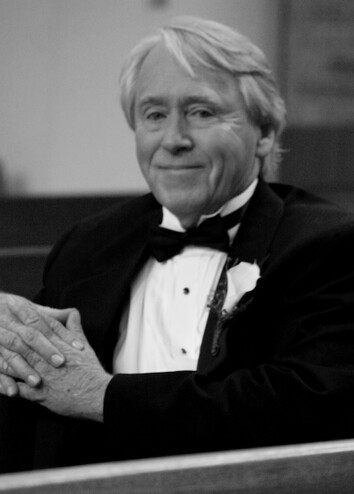 Dedicated image of Larry Bracken, former Executive Director of Government Relations, in formal attir.