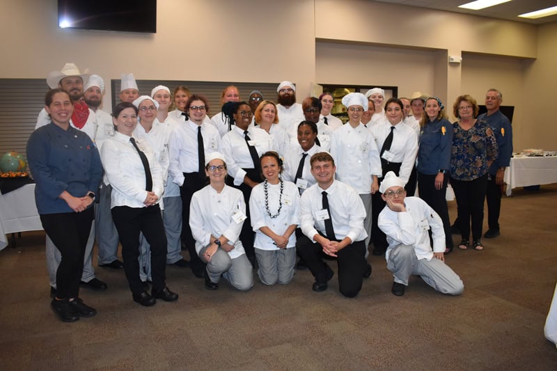 Diverse culinary students and donors gather at PSC's Garde Manger celebration showcasing student-cre.