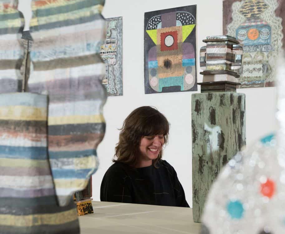 Art student engaging with contemporary art pieces at Pensacola State College.