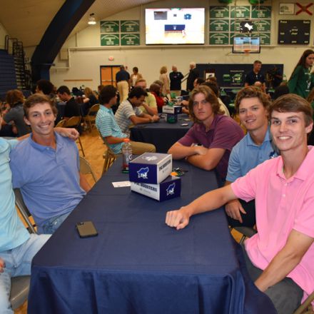 Student athletes engaging in college activities at Pensacola State College's Pirate Experience.