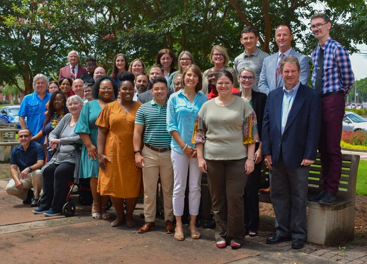Diverse group of students and faculty participating in Pensacola State College's new PLI class, focu.