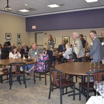 Pensacola State College scholarship event with students and donors celebrating Molly McGuire's $500,.