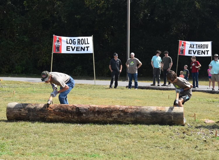 Log roll and axe throwing competitions during the Lumberjack Festival at Pensacola State College.