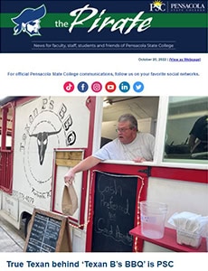 Man serving BBQ at PSC food truck with Texan theme and college logo.