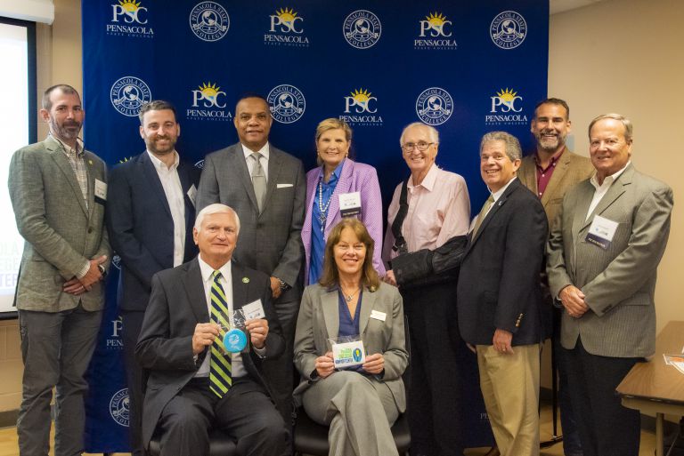 Group photo of PSC officials and community leaders at FPL Nonprofit Center dedication.