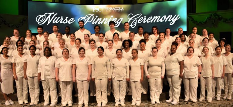 Nursing graduates pinned during Pensacola State College nursing pinning ceremony.
