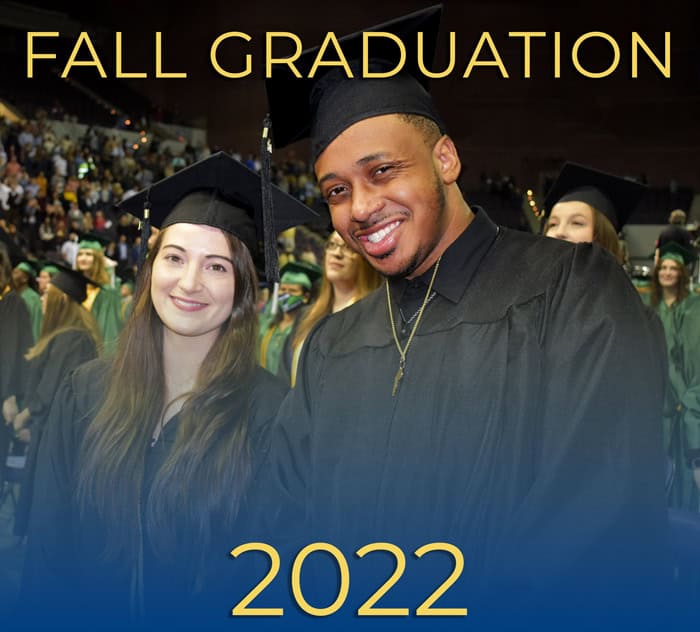 Graduates celebrating at Pensacola State fall graduation event 2022 at Bay Center.