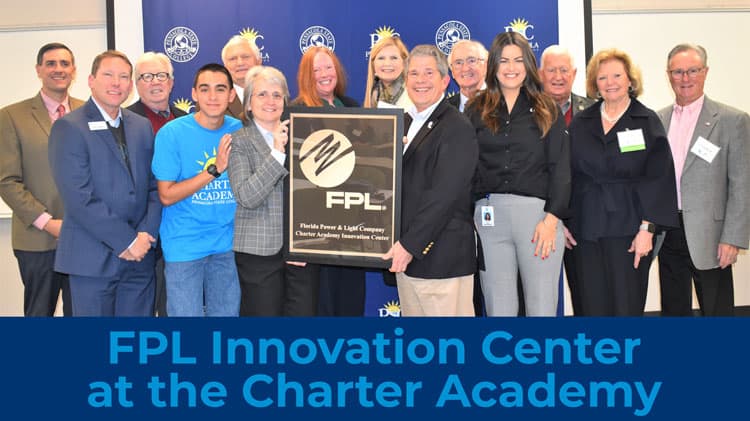 Group photo of officials and students at FPL Innovation Center opening event.