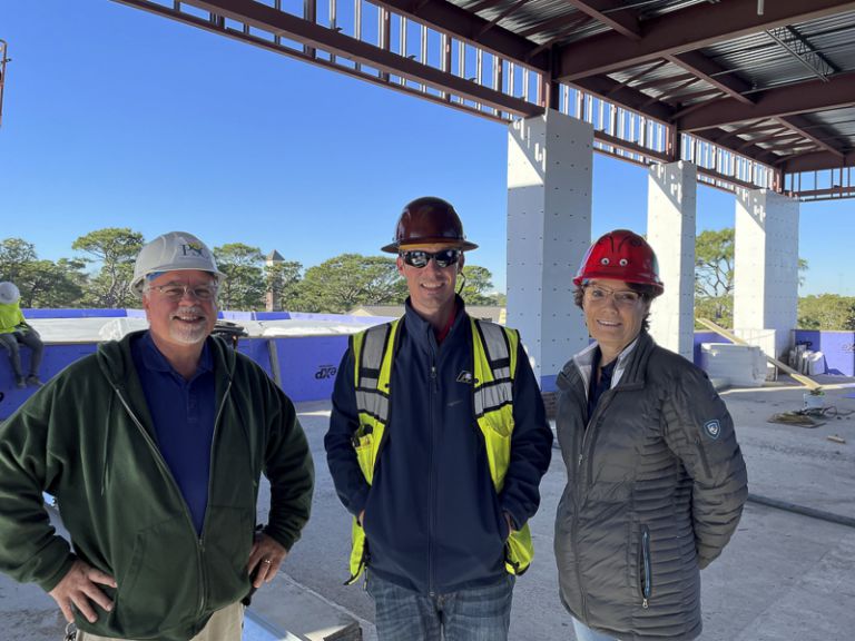 Construction workers inspecting the new campus building at Pensacola State College.