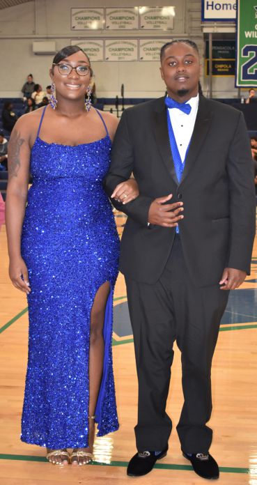 Elegant image of two nursing students dressed in formal attire celebrating their crowning at the 202.