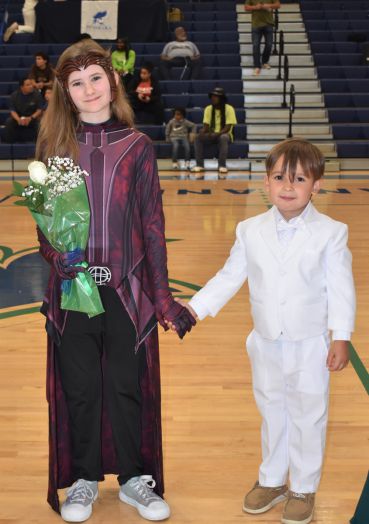 Young girl and boy in formal attire at PSC nursing graduation event.