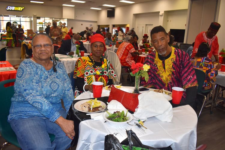 African-American students enjoying a vibrant Black History Celebration at PSC with cultural attire a.