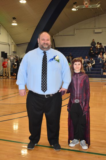 PSC nursing students crowned 2023 Homecoming Queen and King in a school gymnasium event.