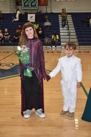 Celebrating PSC nursing students as 2023 Homecoming Queen and King in a gymnasium.