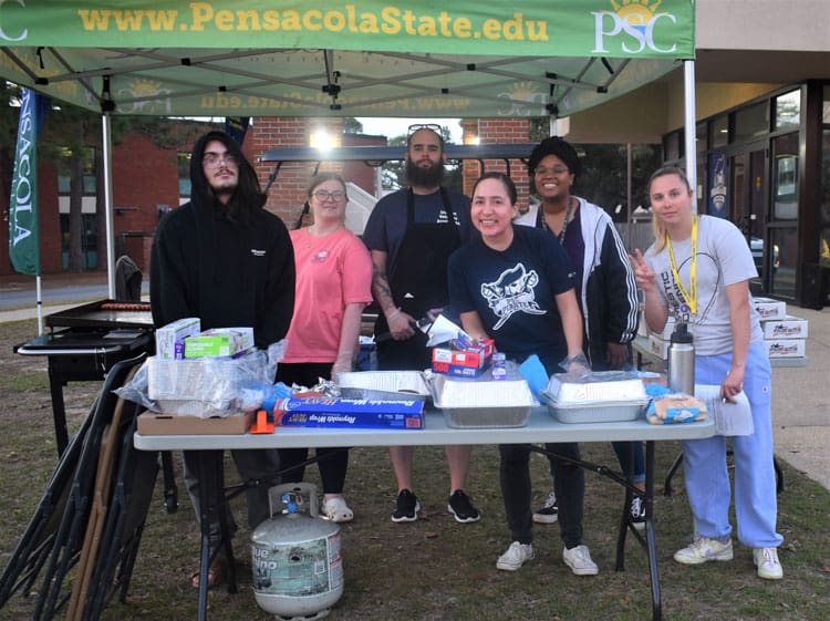 Food drive volunteers at Pensacola State College's Military Appreciation Night event.