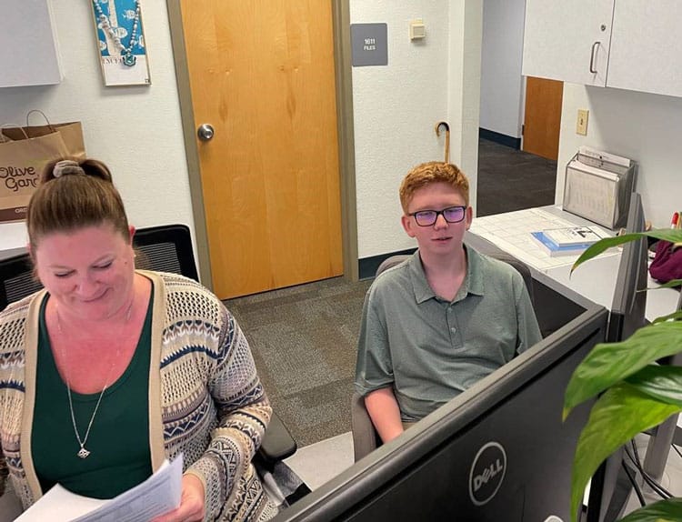 Eighth-grade student intern working at Pensacola State College computer lab during a four-day intern.