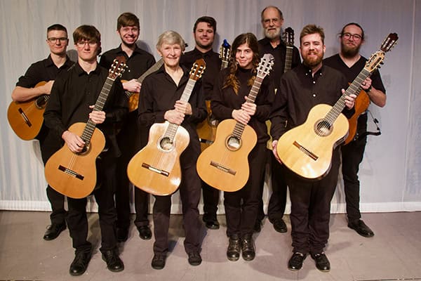 Guitar ensemble at Pensacola State College spring recital, showcasing talented students.